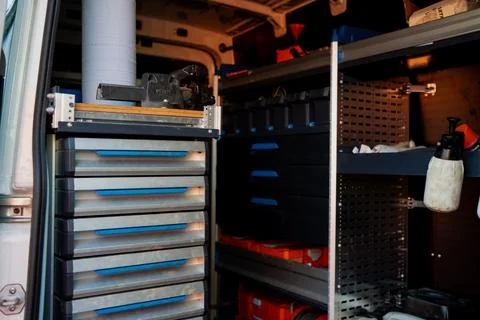 Work van interior with organized tools, drawers and shelves Foto stock