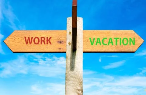 WORK versus VACATION messages written on opposite arrows.  Stock Photos