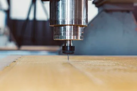 The work of a vertical milling machine. Closeup of a spindle and cutter over a Stock Photos