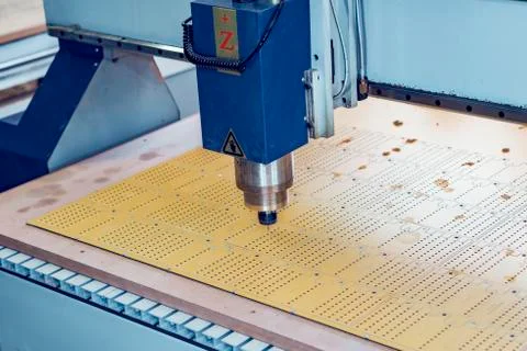 The work of a vertical milling machine. Spindle with a mill in the collet over Stock Photos