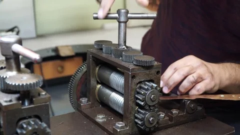 Work on a vintage mechanical tool for cutting and compressing copper plates for  Stock Footage 82624235