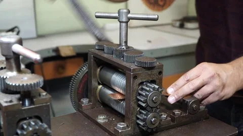 Work on a vintage mechanical tool for cutting and compressing copper plates for  Stock Footage 82624382