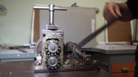 Work on a vintage mechanical tool for cutting and compressing copper plates for  Stock Footage 82624442