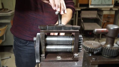 Work on a vintage mechanical tool for cutting and compressing copper plates for  Stock Footage 82624498