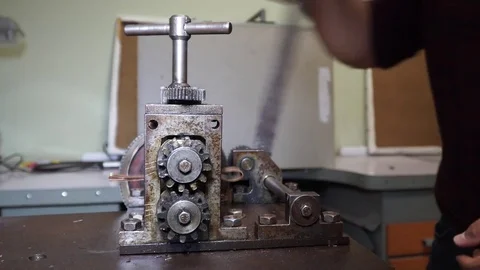 Work on a vintage mechanical tool for cutting and compressing copper plates for  Stock Footage 82624513