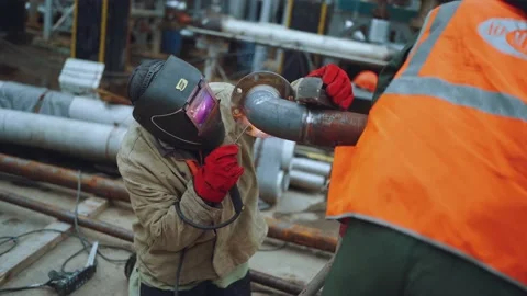 The work of a welder on a construction site, the process of welding metal Stock Footage 221500717