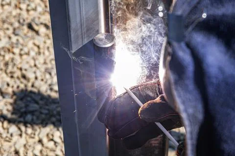 The work of a welder with metal structures. Stock Photos