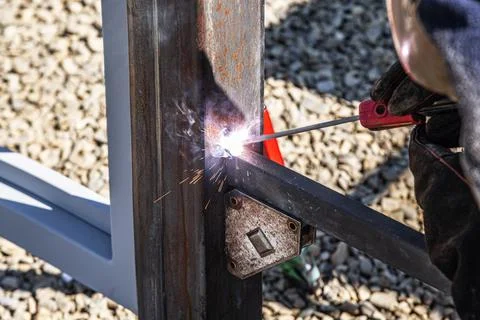 The work of a welder with metal structures. Stock Photos