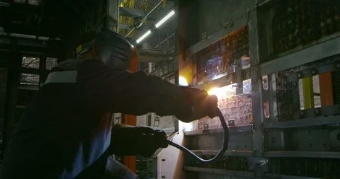 Work of a welder at the plant Stock Footage 99316333