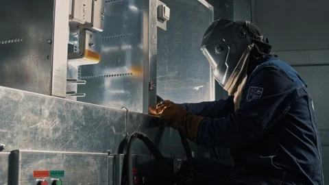 Work of a welder using a welding machine with cables and hoses Stock Footage 265509677