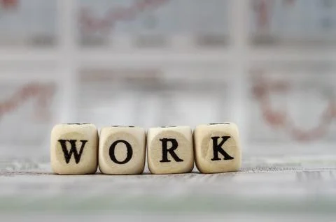 Work word built with letter cubes on newspaper background Stock Photos