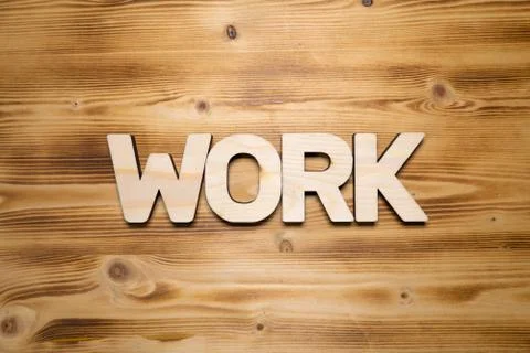 WORK word made with building blocks on wooden board Stock Photos