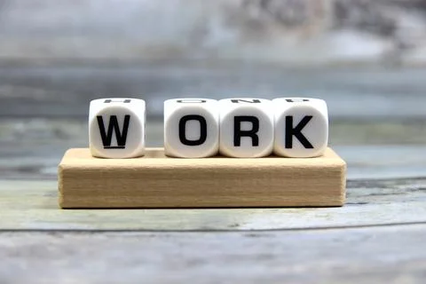Work wording  or text on white dice with grey background.Copy space and bus.. Stock Photos