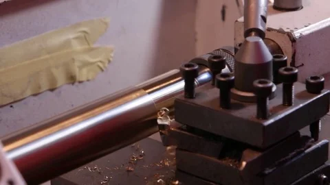 Work in the workshop on a lathe with a brass workpiece Stock Footage 76938858