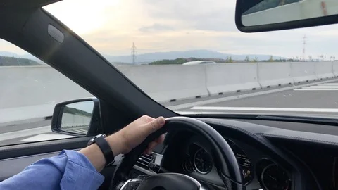 Workaholic business man driving a car to work early morning. Man driving vehicle Stock Footage 118250153