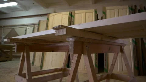 Workbench with board near future inner doors in workshop Stock Footage 141119898