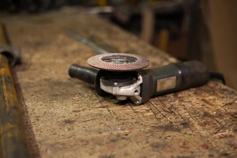Workbench with a power tool lying on it Foto stock