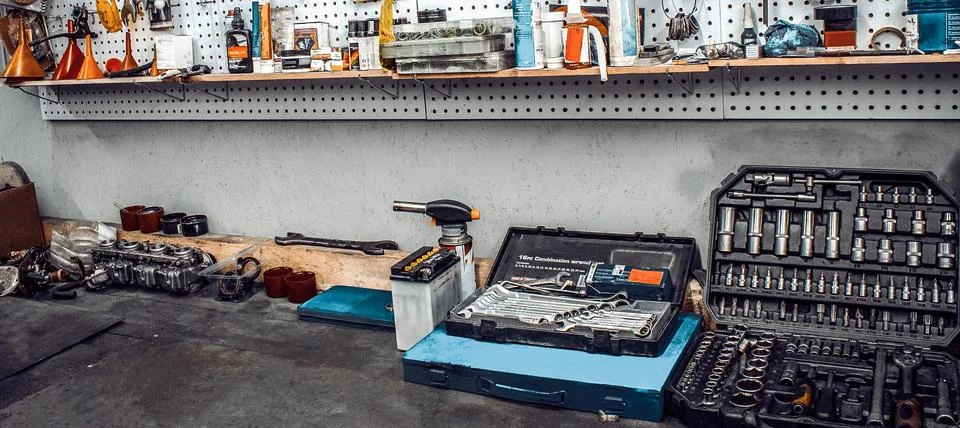 Workbench with tools kit and spare parts Stock Photos