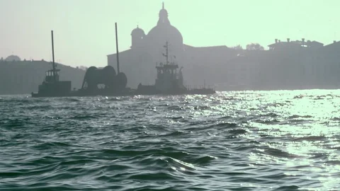 Workboat Navigates Sparkling Giudecca Waters in Venice at Sundown Stock Footage 86175244