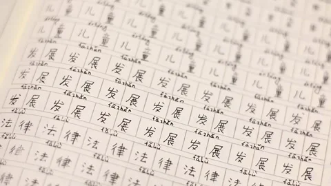 Workbook for learning Chinese - Slow panning shot Stockbeeldmateriaal 133011795