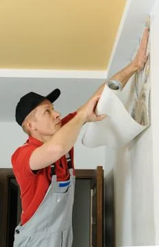 Worker adhesive wallpapers. Stock Photos