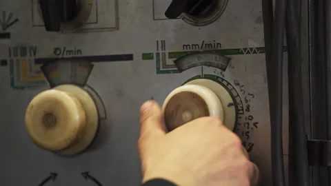 Worker adjusting control knobs on industrial machinery. Stock clip Stock Footage 312072566