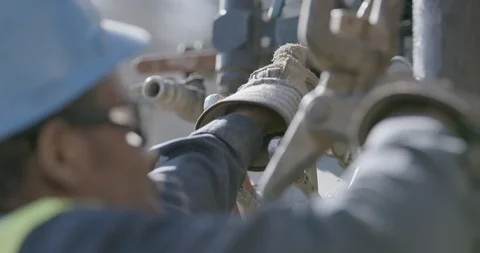 Worker adjusting drill auger machine Stock Footage 145282634