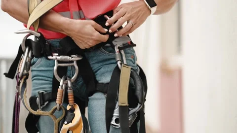 Worker Adjusting Rope Access Harness for Work at Height Stock Footage 346496424