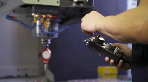 The worker adjusts calibration of cnc machine Видео 55014896