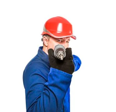 Worker aims drill. Stock Photos