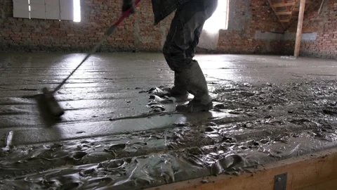 Worker align level of liquid monolithic foam concrete for warming of building. Stock Footage 151922409