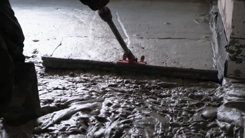 Worker align level of liquid monolithic foam concrete for warming of house. Stock Footage 152174116