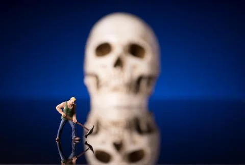 Worker and blurry skull Stock Photos