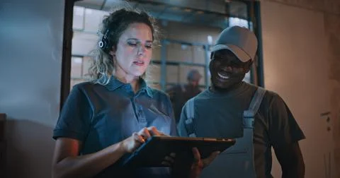Worker and Female Manager Using Tablet Computer, Standing Outside of Logistics Stock Photos