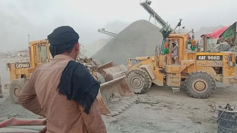 Worker And Heavy Loaders At Quarry - Sargodha, Pakistan - August 27, 2026 Video stock 344289838