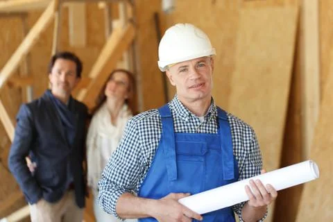 Worker and house design plans Stock Photos