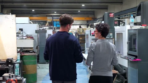Worker and manager talking walking in a factory Stock Footage 293320772