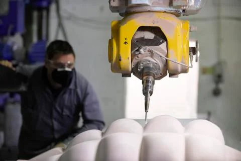 Worker and multi axis machine Stock-Fotos