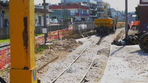 Worker and operating machine in action for reconstruction work on the railway Stock-Footage 105750023