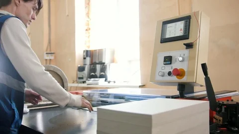 Worker and printing machine, polygraph industry Stock Footage 76931986