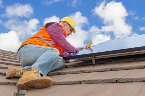 Worker and solar panels Stock Photos