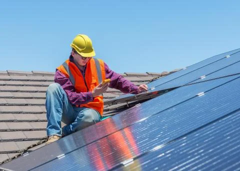 Worker and solar panels Stock Photos