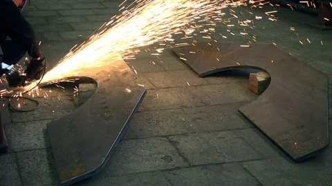 Worker with angle grinder does metalworking in Industrial environment. Stock Footage 122453766
