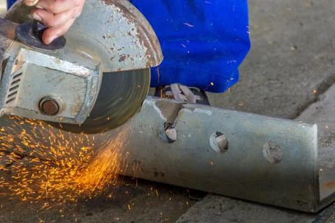 Worker with angle grinder Stock Photos