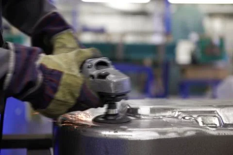 Worker with angle grinder Stock Photos