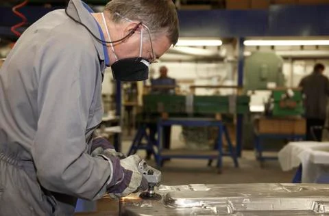 Worker with angle grinder Stock Photos
