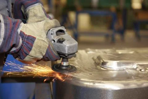 Worker with angle grinder Stock Photos