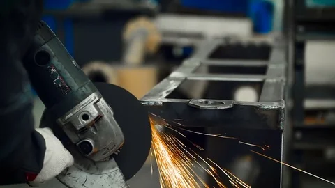 Worker with angular grinding machine Stock Footage 80825667