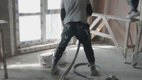 Worker apply plaster on the wall in pandemic Stock Footage 130048913