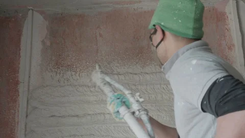 Worker apply plaster on the wall in pandemic Stock Footage 130048980